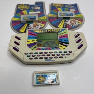 Wheel of Fortune 1995 Tiger Hand Held Electronic Game with 3 Cartridge read